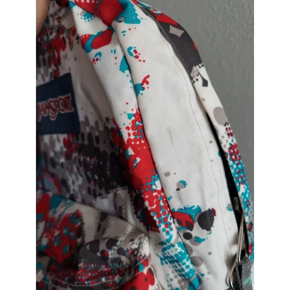 Jansport White Backpack with Red, Gray and Teal Graphic Print